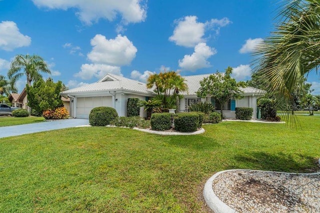 view of front facade with a garage and a front yard