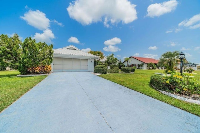 single story home with a garage and a front lawn