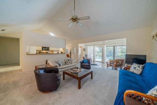 living room featuring ceiling fan, light colored carpet, and high vaulted ceiling