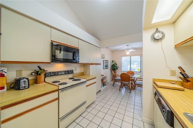 kitchen featuring lofted ceiling, white cabinets, light tile patterned floors, ceiling fan, and white appliances