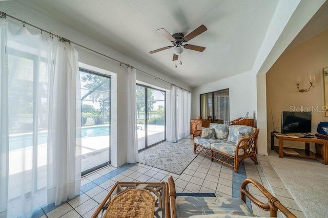 sunroom with ceiling fan