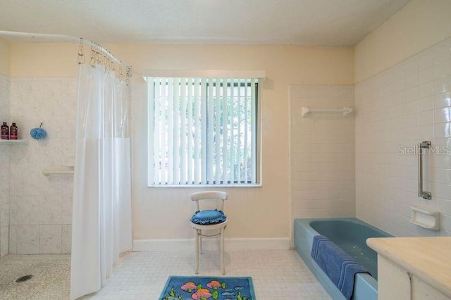 bathroom featuring tile patterned flooring and a washtub