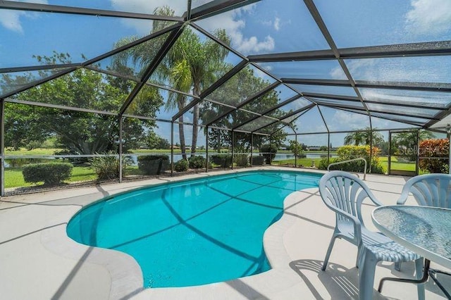 view of pool with a lanai and a patio area