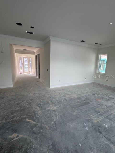 spare room featuring crown molding