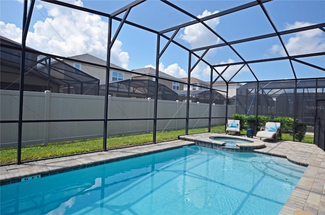 view of swimming pool featuring an in ground hot tub, a lanai, and a patio area