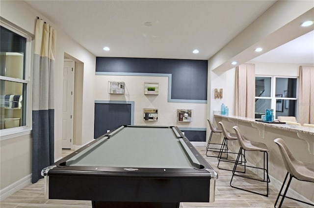 game room with billiards and light hardwood / wood-style flooring