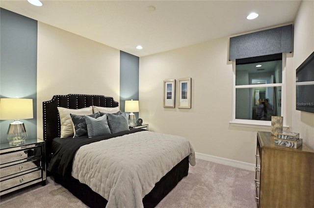 bedroom featuring light carpet