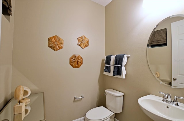 bathroom with sink and toilet