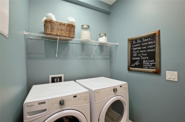 laundry area with washing machine and dryer