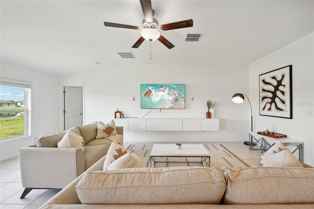 tiled living room with ceiling fan