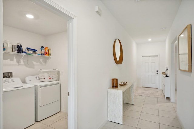 laundry area with light tile patterned flooring and independent washer and dryer