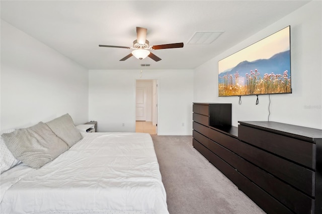 bedroom featuring ceiling fan and light carpet