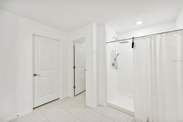 bathroom featuring tile patterned flooring and a shower with shower curtain