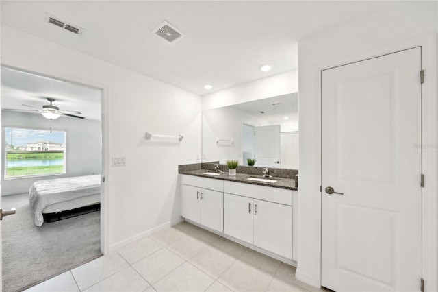 bathroom with ceiling fan, tile patterned flooring, and vanity