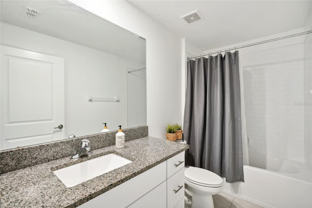 full bathroom with tile patterned floors, vanity, shower / tub combo, and toilet