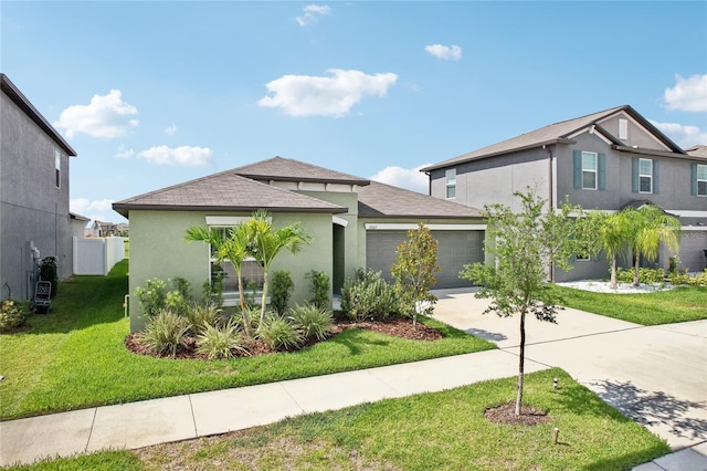 view of front of house featuring a front yard and a garage