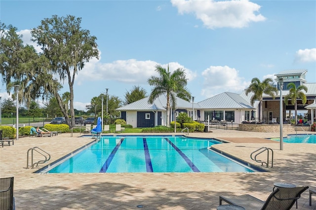 view of pool featuring a patio