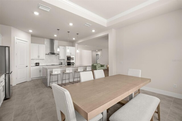 dining space featuring light tile patterned flooring