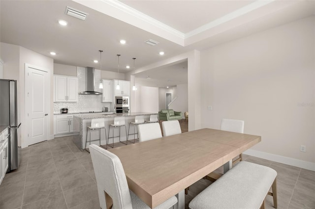 dining room with light tile patterned floors, baseboards, visible vents, and recessed lighting