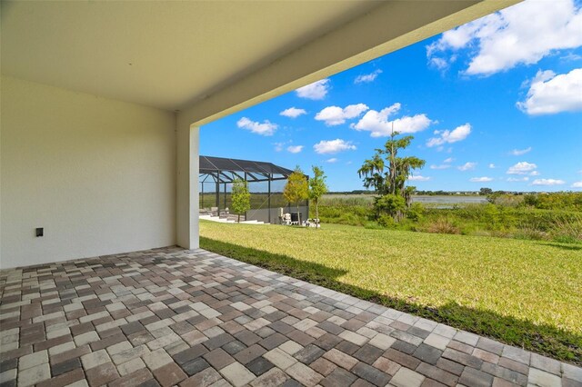 view of patio / terrace featuring a lanai