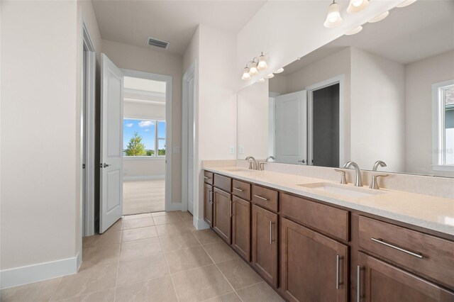 bathroom with vanity and tile patterned floors