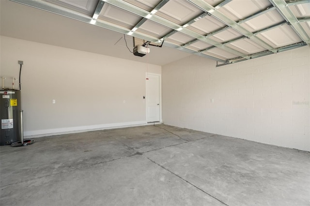 garage with water heater and a garage door opener