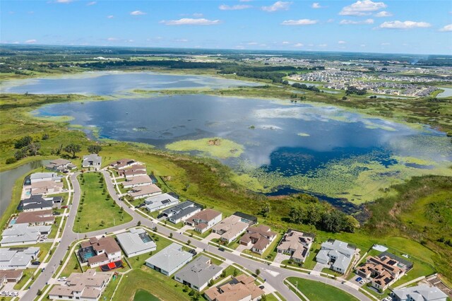 drone / aerial view with a water view