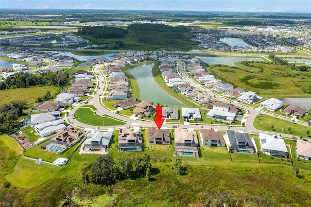 bird's eye view featuring a water view and a residential view