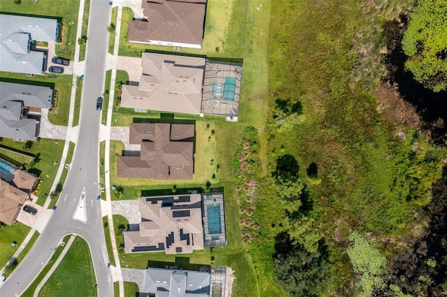 birds eye view of property with a residential view