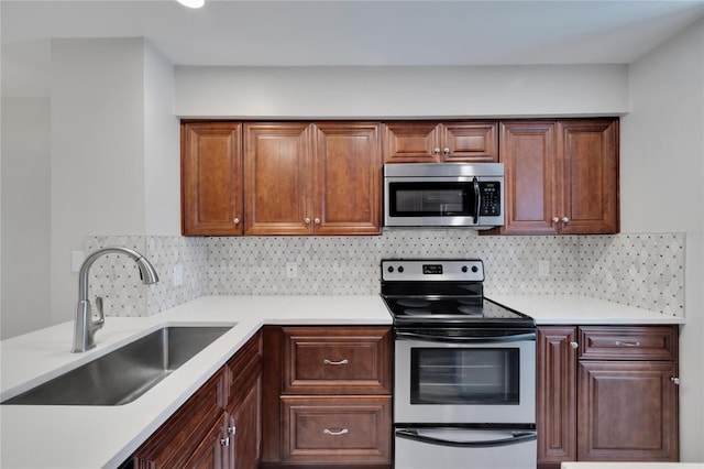 kitchen featuring sink, decorative backsplash, and stainless steel appliances