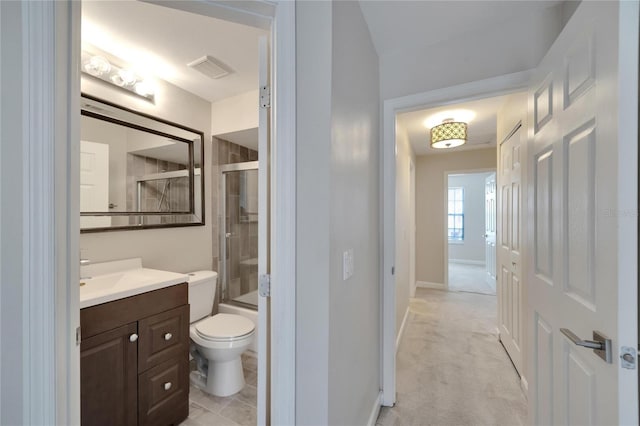 full bathroom with vanity, enclosed tub / shower combo, and toilet