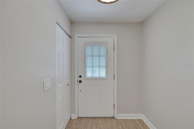 entryway with light hardwood / wood-style floors