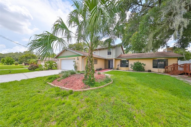 view of front of house featuring a front yard and a garage