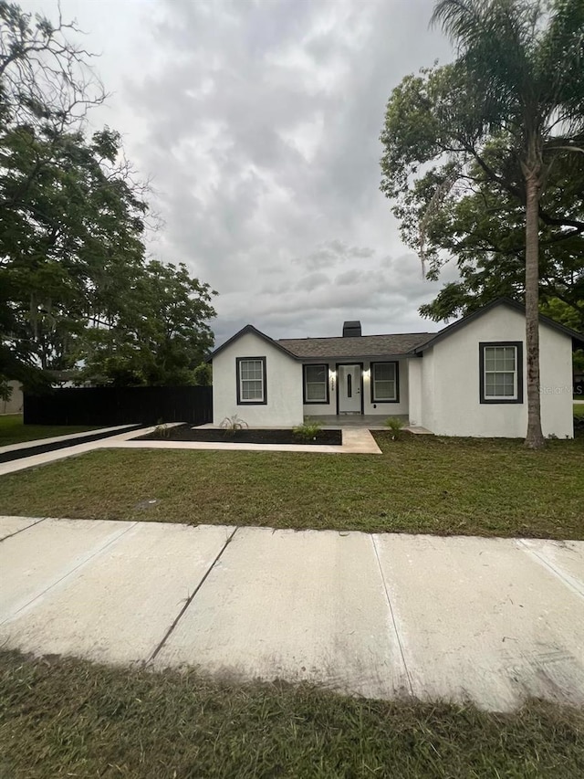 view of front of home with a front yard