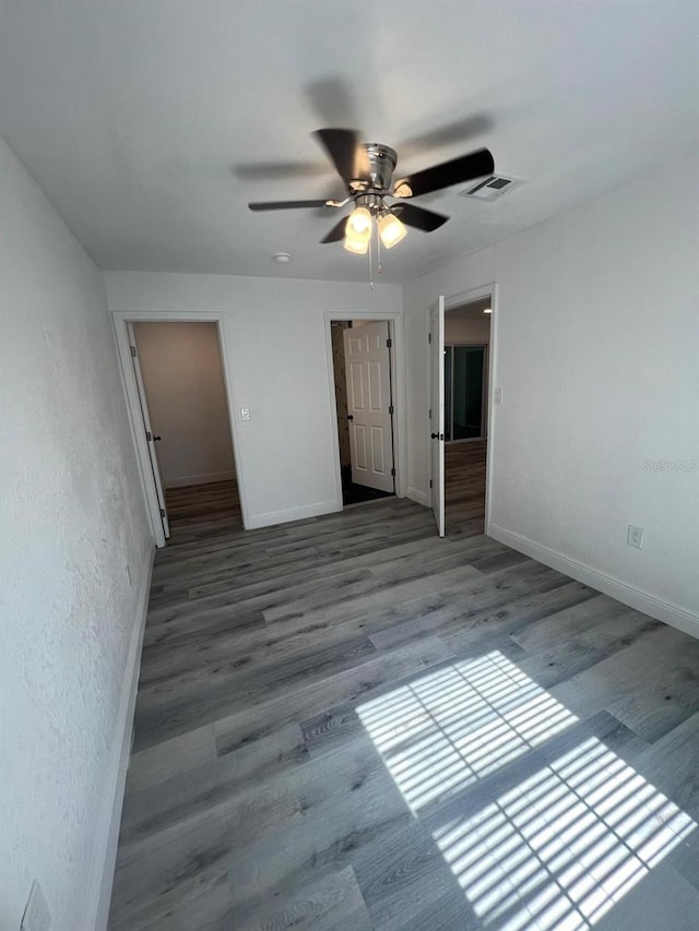 spare room featuring ceiling fan and hardwood / wood-style floors