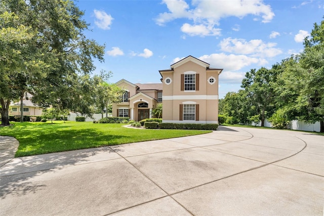 view of front of property with a front lawn and stucco siding