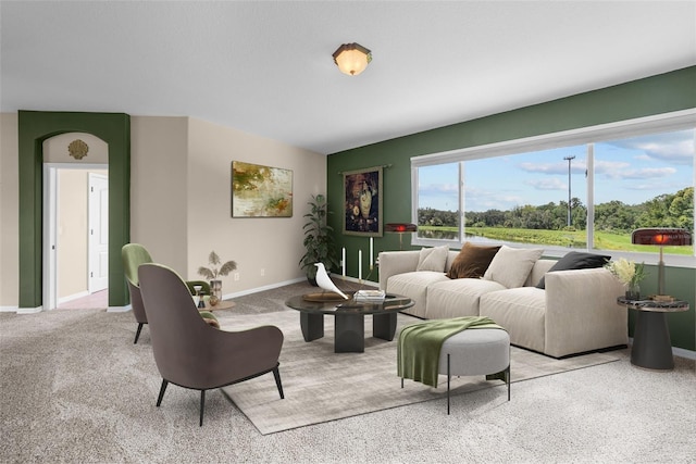 living room with light colored carpet and baseboards