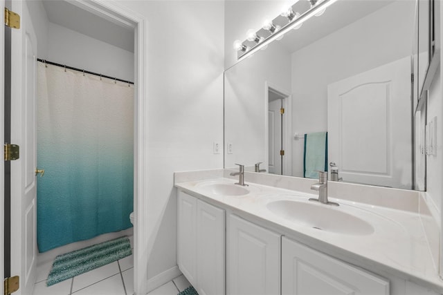 full bathroom with tile patterned floors, a sink, toilet, and double vanity