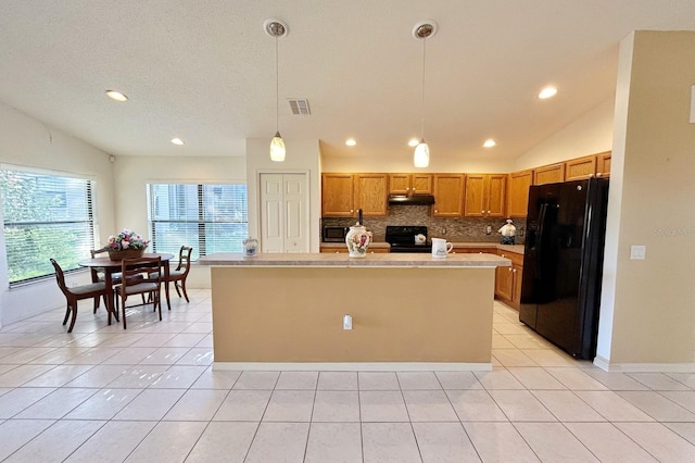11416 Billingham Blvd, Spring Hill, FL 34609 - kitchen featuring black appliances, lofted ceiling, under cabinet range hood, recessed lighting, and light countertops