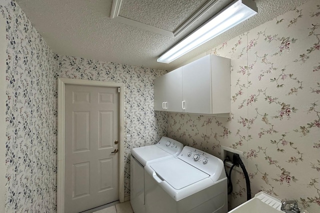 11416 Billingham Blvd, Spring Hill, FL 34609 - washroom featuring a textured ceiling, cabinet space, washer and dryer, wallpapered walls, and light tile patterned floors
