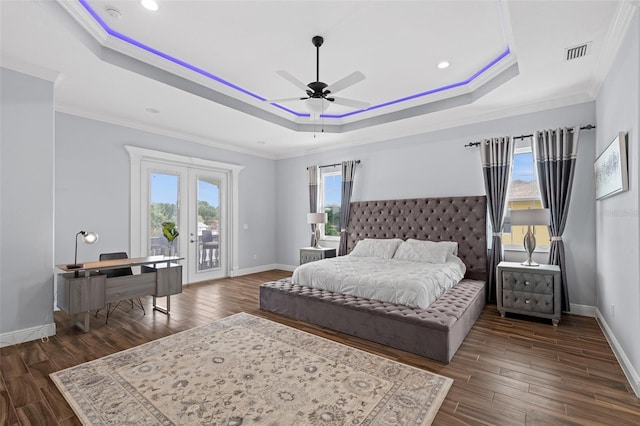 bedroom featuring french doors, ceiling fan, a raised ceiling, and access to outside