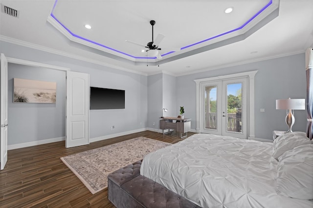 bedroom featuring french doors, dark wood-type flooring, a raised ceiling, ceiling fan, and access to exterior