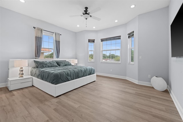 bedroom featuring light hardwood / wood-style flooring and ceiling fan