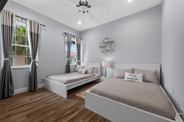 bedroom featuring multiple windows and ceiling fan