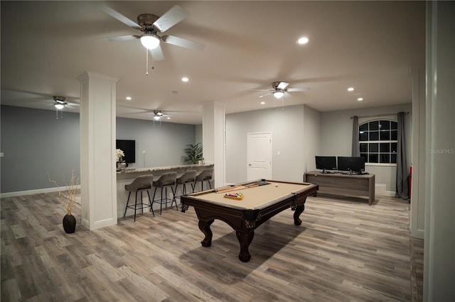 playroom with hardwood / wood-style flooring, billiards, and bar area