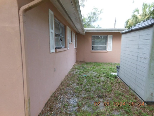 view of side of property with stucco siding