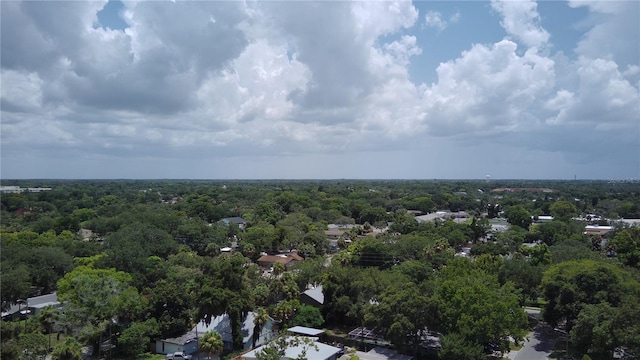 aerial view featuring a wooded view