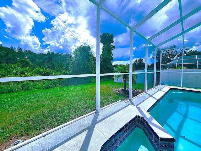 view of pool featuring a lanai, a patio area, and a yard