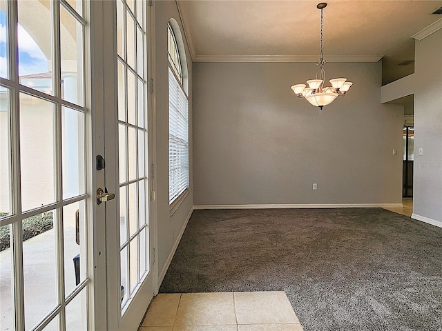 empty room with baseboards, light carpet, a notable chandelier, and crown molding