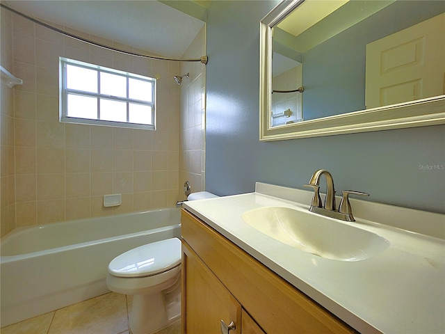 bathroom featuring shower / bathing tub combination, toilet, vanity, and tile patterned flooring